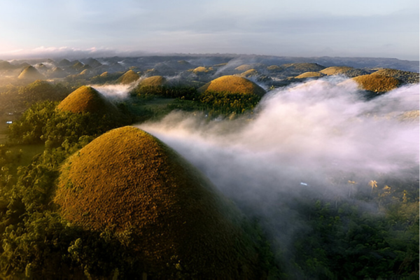 Clouds are touching Bohol's Chocolate Hills.