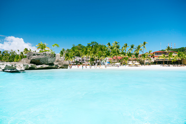 Blue sky with few clouds at Boracay's white beach.