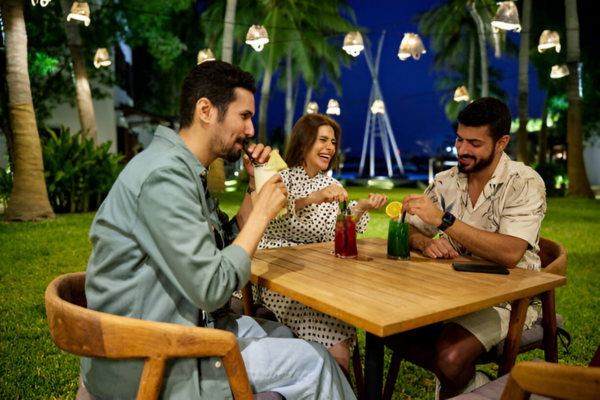 Men and women spending time at a restaurant in Saudi Arabia.