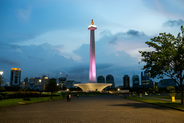 Jakarta’s National Monument illumiantes itself after the sun sets.