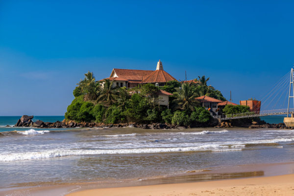 Paravi Duwa Temple is surrounded by the Indian Ocean.